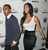 Nicole Scherzinger very busty showing a great cleavage in white tank top at Madden NFL '09 VIP premiere party