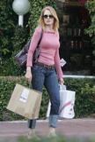 Marg Helgenberger in jeans and pink top