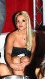 Britney Spears shows her cleavage and legs in short body hugging black dress at Ed Hardy Party in Hollywood